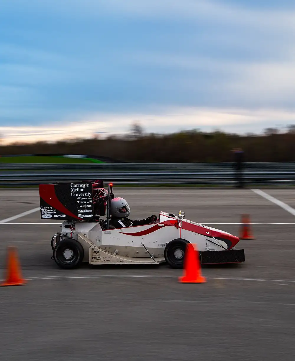 Photo of the CMR 24e car at a Formula SAE competition